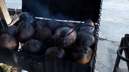 the process of burning coconuts which are then mixed with special spices to be served as a typical Indonesian drink made from roasted coconut