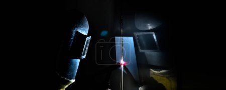 Photo for Industrial argon welder, argon welder uses torch to make sparks during manufacture of metal equipment - Royalty Free Image