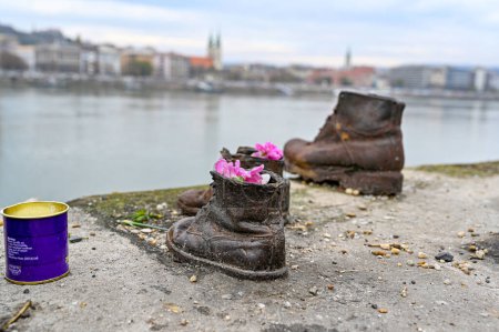 Photo for Budapest Hungary, November 24 2022 Shoes on the Danube Bank memorial to honour the Jews who were massacred in Second world war - Royalty Free Image