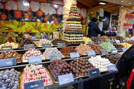 Photo for Market stand with balls of marzipan candy at Szent Istvan Ter Budapest Hungary november 22 2022 - Royalty Free Image