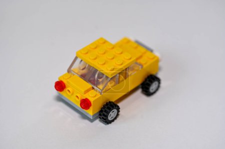 Foto de Yellow car built of lego blocks on white table Sweden january 2023 - Imagen libre de derechos