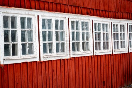 Old small windows on barn close together Motala Sweden April 6 2024