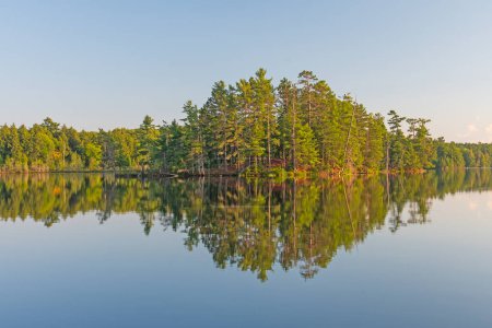 Quiet Reflections in the Early Morning on Mountain Lake in the Sylvania Wilderness in Michigan