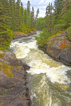 Tumbling Rapids in the Rocky Forest on the Grass River in Weskusko Provincial Park in Manitoba