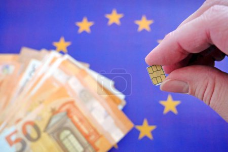Photo for European Union flag, cash money euro and  sim card. concept, closeup - Royalty Free Image