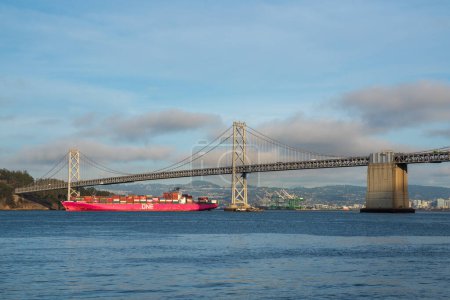 Photo for San Francisco, CA, USA - November 04, 2022 - The One Olympus makes its way under the Oakland Bay Bridge. High quality photo - Royalty Free Image