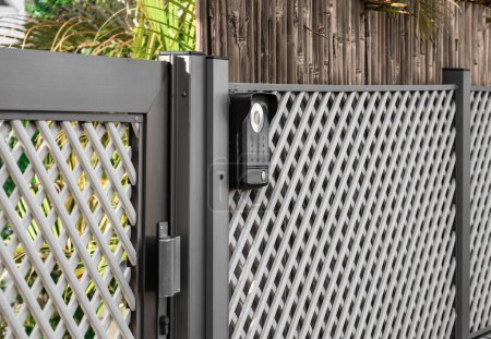 Photo for Modern intercom on fence outdoors, closeup - Royalty Free Image