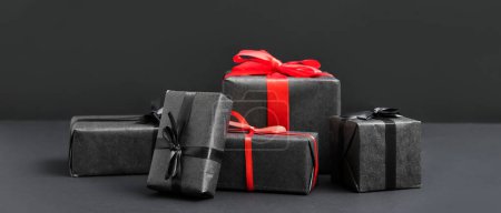 Photo for Different gift boxes on black background - Royalty Free Image