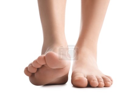 Female bare feet on white background