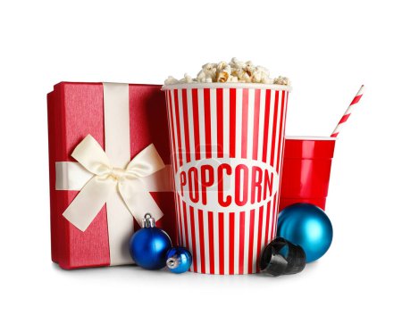 Photo for Bucket of popcorn, cup, Christmas balls and present on white background - Royalty Free Image