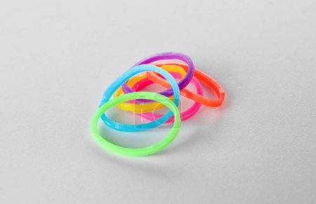 Colorful office rubber bands on white background
