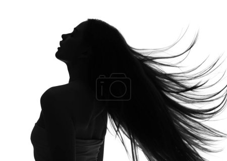 Silhouette of young woman with long hair on white background