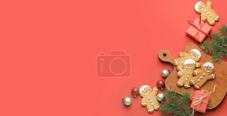 Photo for Tasty gingerbread cookies, gifts and Christmas decor on red background with space for text - Royalty Free Image