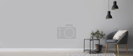 Foto de Interior de la moderna sala de estar con sillón y mesa. Banner para el diseño - Imagen libre de derechos