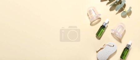 Photo for Composition with bottles of essential oil, pumice and vacuum jars for anti-cellulite massage on color background with space for text - Royalty Free Image