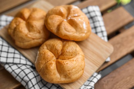 Photo for Kaiser rolls on wooden board, closeup - Royalty Free Image