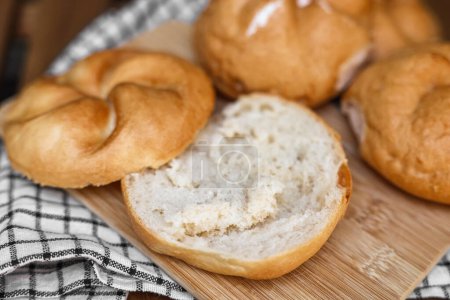 Photo for Delicious kaiser rolls on wooden board - Royalty Free Image