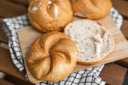 Photo for Delicious kaiser rolls on wooden board - Royalty Free Image