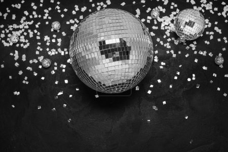 Photo for Disco balls with confetti on black background - Royalty Free Image