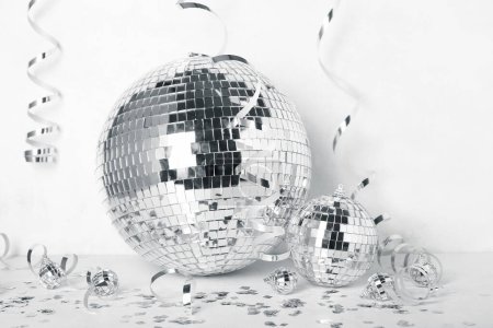 Photo for Disco balls with serpentine and confetti on white background - Royalty Free Image
