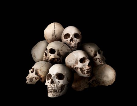 Many human skulls on black background
