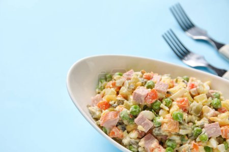 Photo for Bowl of tasty Olivier salad on color background, closeup - Royalty Free Image
