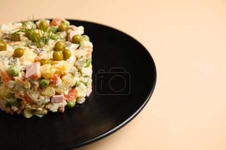 Photo for Plate with delicious Olivier salad on color background, closeup - Royalty Free Image
