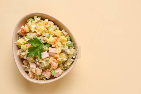 Photo for Bowl of delicious Olivier salad on color background - Royalty Free Image