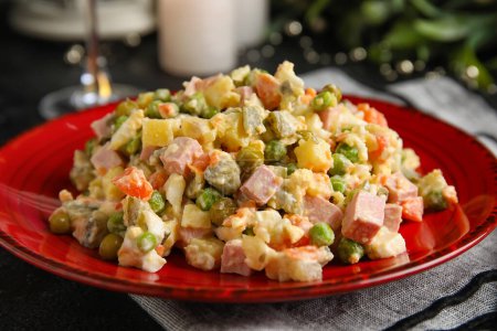 Photo for Plate of tasty Olivier salad on dark background, closeup - Royalty Free Image