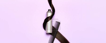 Photo for Hair spray with strand and comb on lilac background - Royalty Free Image