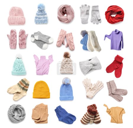 Collection of stylish knitted sweaters and accessories on white background