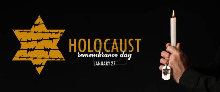 Photo for Banner for International Holocaust Remembrance Day with praying Jewish man holding candle on dark background - Royalty Free Image