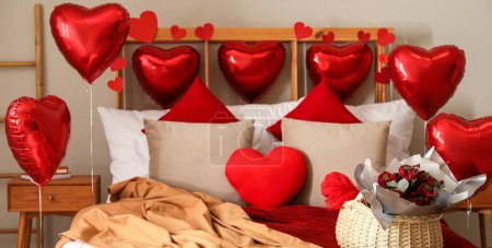 Photo for Interior of bedroom decorated for Valentine's Day with red heart shaped balloons - Royalty Free Image