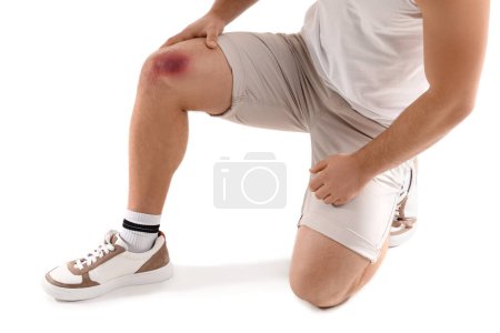 Photo for Man with bruise on knee against white background - Royalty Free Image