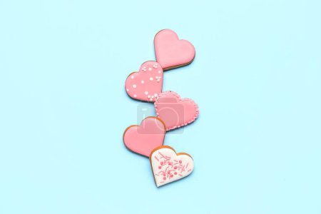Foto de Composition with sweet heart shaped cookies on color background. Valentine's Day celebration - Imagen libre de derechos