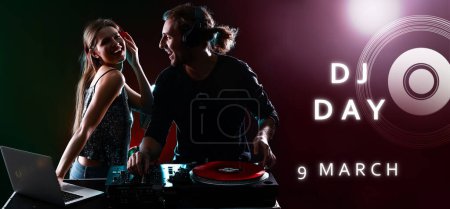 Téléchargez les photos : Young djs playing music in nightclub. Banner for World DJ Day - en image libre de droit