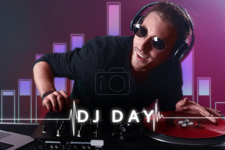 Téléchargez les photos : Male dj playing music in nightclub. Poster for World DJ Day - en image libre de droit