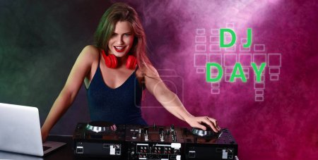 Téléchargez les photos : Female dj playing music in nightclub. Banner for World DJ Day - en image libre de droit