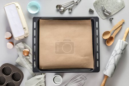Photo for Baking trays with utensils on light background - Royalty Free Image
