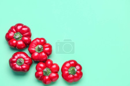 Foto de Red bell peppers on color background - Imagen libre de derechos