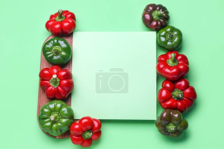 Foto de Composition with fresh bell peppers and blank sheet of paper on color background - Imagen libre de derechos