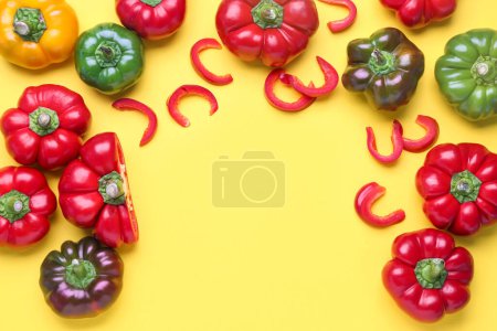 Foto de Fresh bell peppers on yellow background - Imagen libre de derechos
