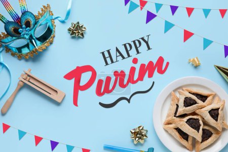 Foto de Beautiful greeting card for Purim holiday with carnival mask and Hamantaschen cookies on blue background - Imagen libre de derechos