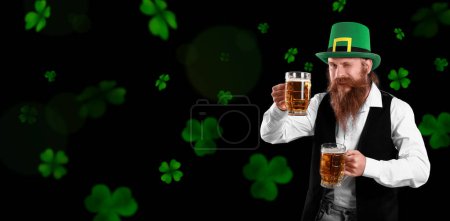 Foto de Bearded man with beer on dark background. Banner for St. Patrick's Day - Imagen libre de derechos
