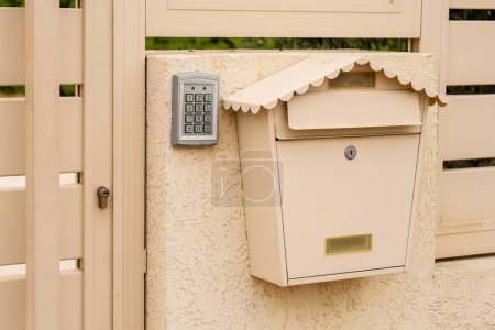 Photo for Modern fence with intercom and mailbox outdoors - Royalty Free Image