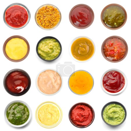 Collection of tasty sauces in bowls on white background, top view