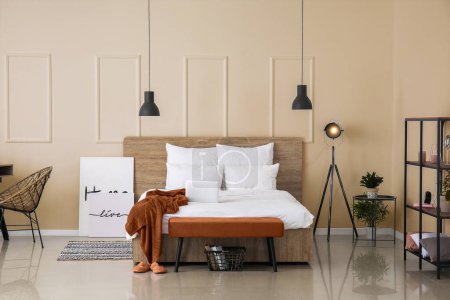 Photo for Big bed and bench in interior of light room - Royalty Free Image