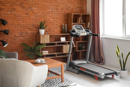 Téléchargez les photos : Interior of living room with modern treadmill - en image libre de droit