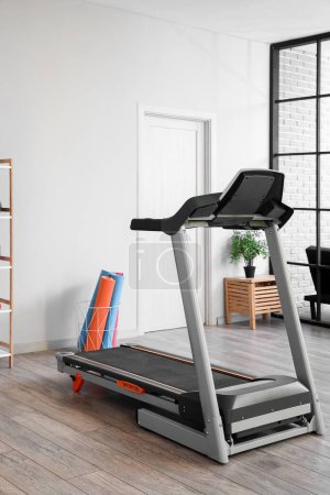 Photo for Interior of gym with modern treadmill and sport equipment - Royalty Free Image