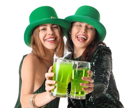Young women with glasses of beer on white background. St. Patrick's Day celebration